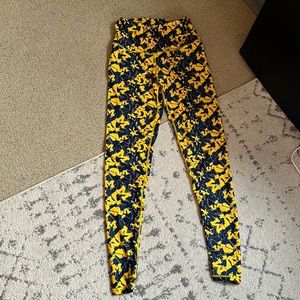 UNIVERSITY OF MICHIGAN LEGGINGS with blue and yellow Ms. size xs.